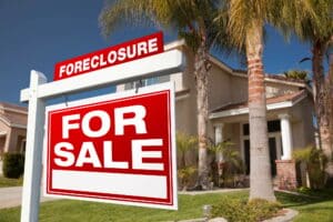 Foreclosure For Sale Real Estate Sign and House